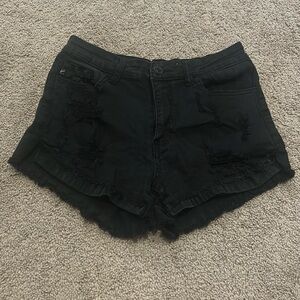 Juniors black stretchy destroyed shorts.